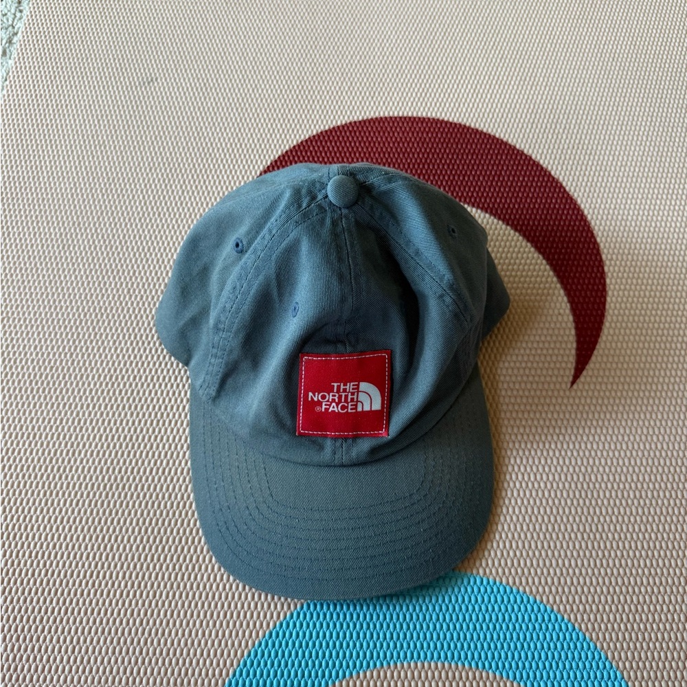 The North Face Gray Cap with Red Logo